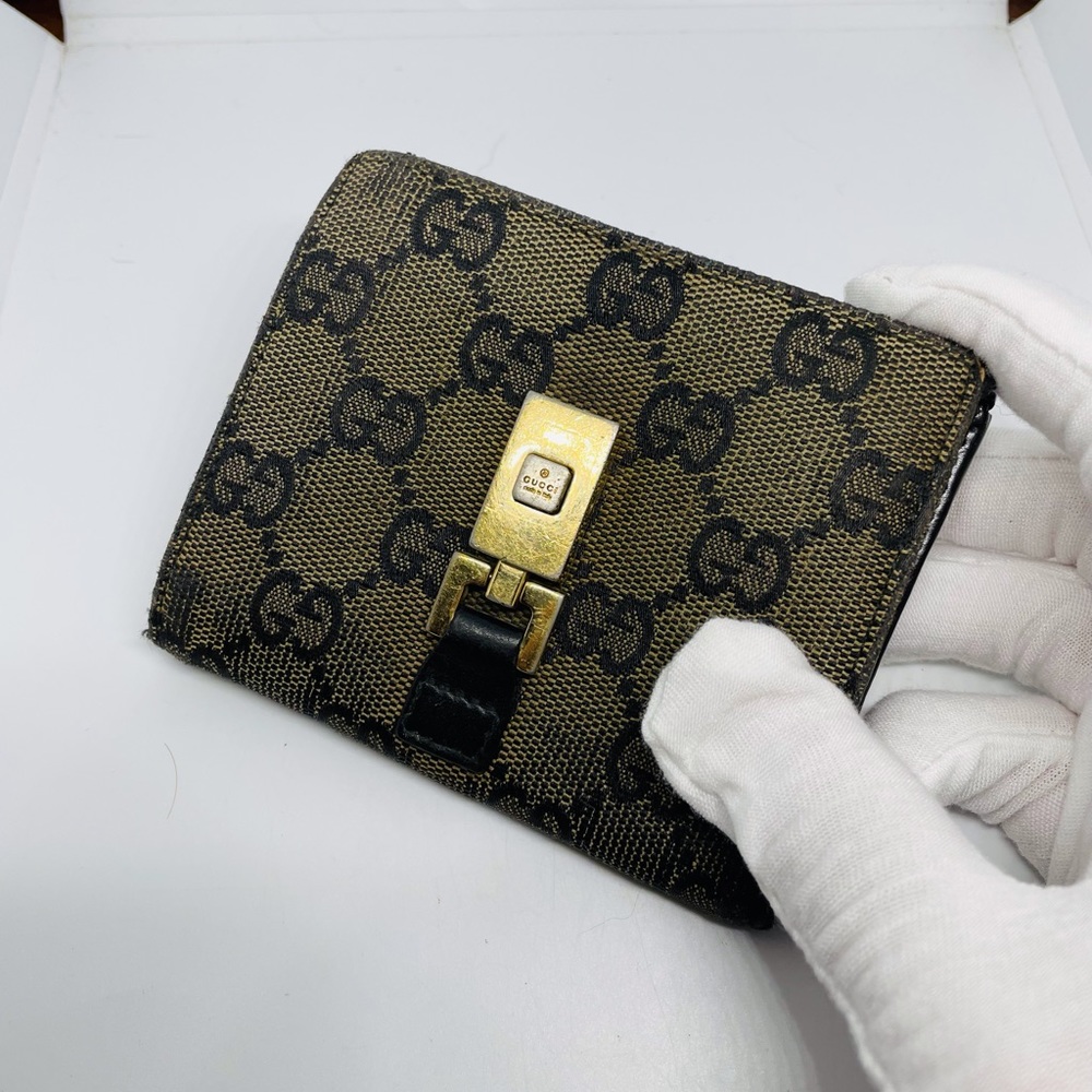 Gucci Black and Gold Monogram Wallet
